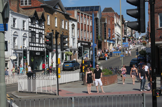 A photograph of a high street rising up a hill