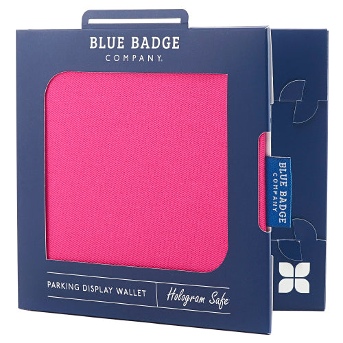 Disabled Blue Badge Wallet in Pink Panama, packed in blue badge company recyclable packaging. The Blue Badge Co label sits outside the card box through a side gap. Packaging reads "Blue Badge Company" at the top and "Parking Display Wallet, Hologram Safe" at the bottom.